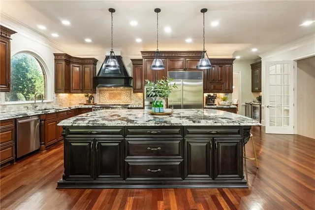 a bedroom with a large bed and a large window