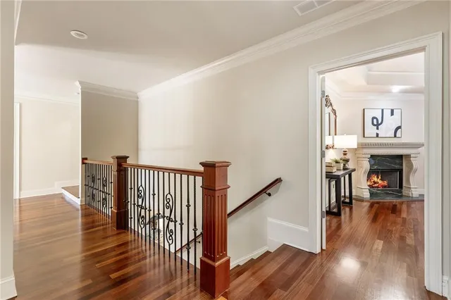 a bathroom with a granite countertop sink toilet mirror and shower