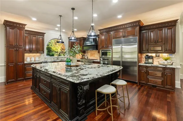 a spacious bathroom with a tub sink shower and mirror