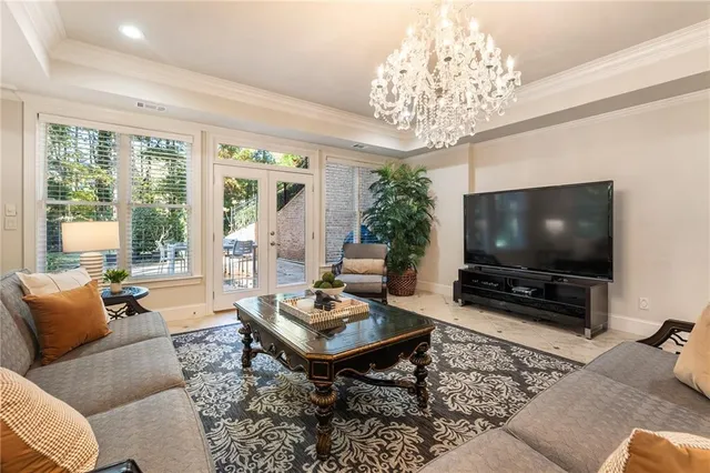 front view of house with a potted plant windows