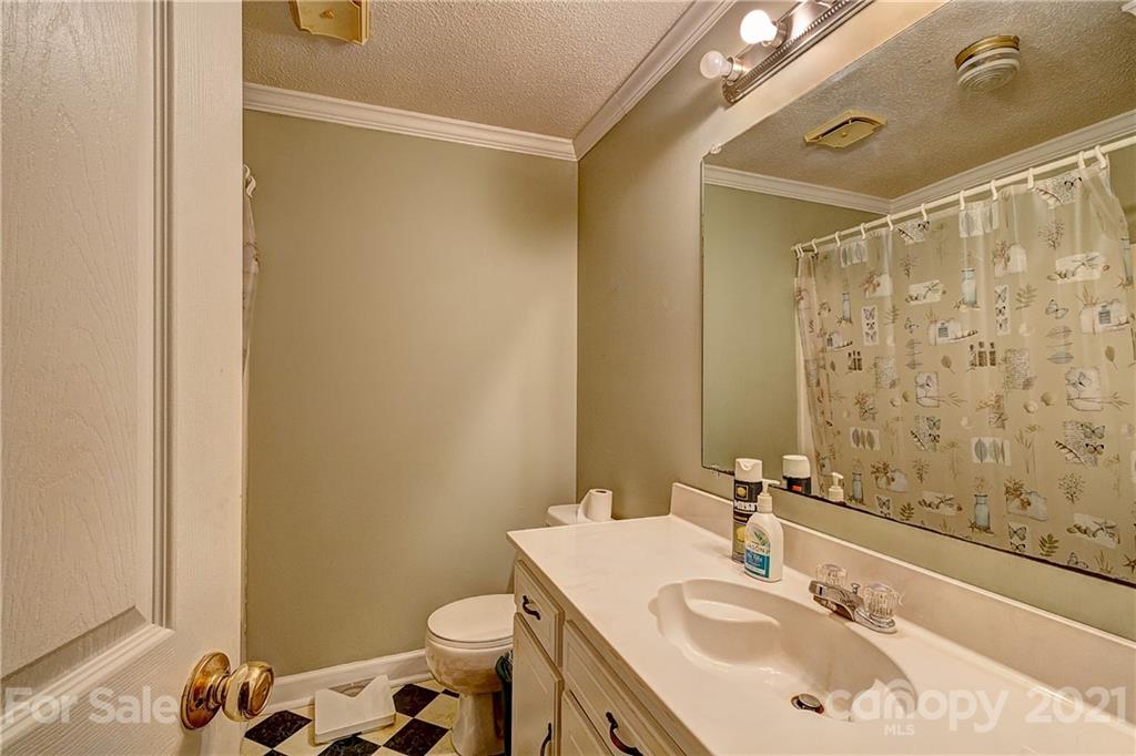 202 West Main Street Cherryville, NC 28021 - Photo 11 of 17 a bathroom with a sink toilet and shower