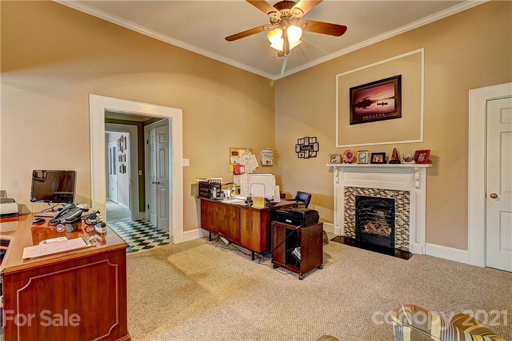 202 West Main Street Cherryville, NC 28021 - Photo 13 of 17 a bedroom with furniture and a fireplace