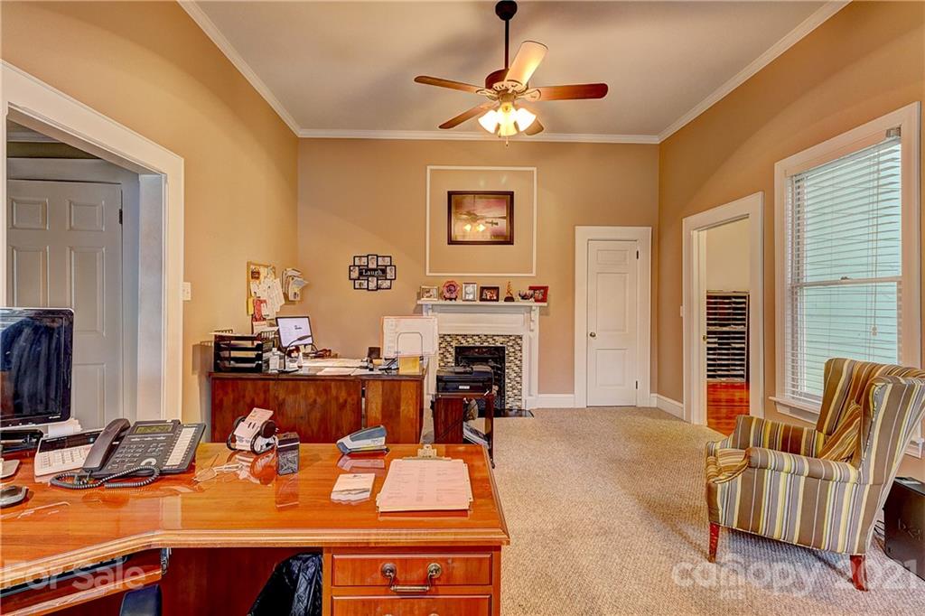 202 West Main Street Cherryville, NC 28021 - Photo 15 of 17 a living room with furniture fireplace and flat screen tv