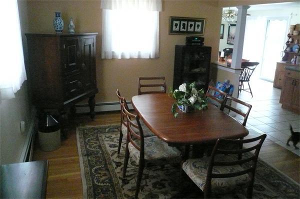 23 Whittier Road Billerica, MA 01821 - Photo 12 of 25 a view of a dining room with furniture and wooden floor