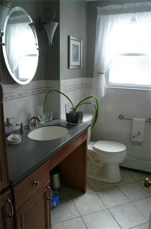 23 Whittier Road Billerica, MA 01821 - Photo 17 of 25 a bathroom with a toilet sink and mirror