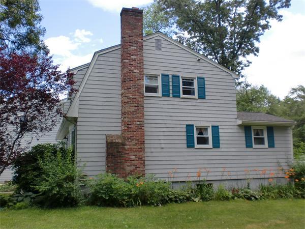 23 Whittier Road Billerica, MA 01821 - Photo 2 of 25 a view of a house with a yard and potted plants