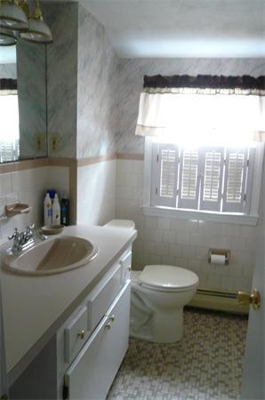 23 Whittier Road Billerica, MA 01821 - Photo 22 of 25 a bathroom with a sink toilet and shower