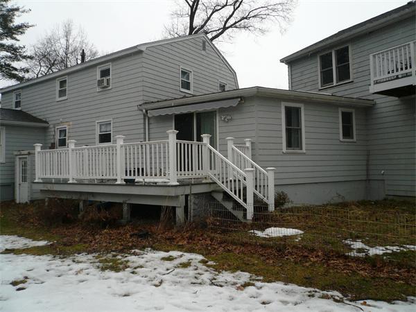 23 Whittier Road Billerica, MA 01821 - Photo 24 of 25 a view of a house with wooden fence
