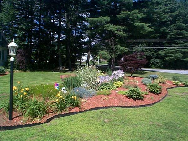 23 Whittier Road Billerica, MA 01821 - Photo 4 of 25 a view of a garden with flowers