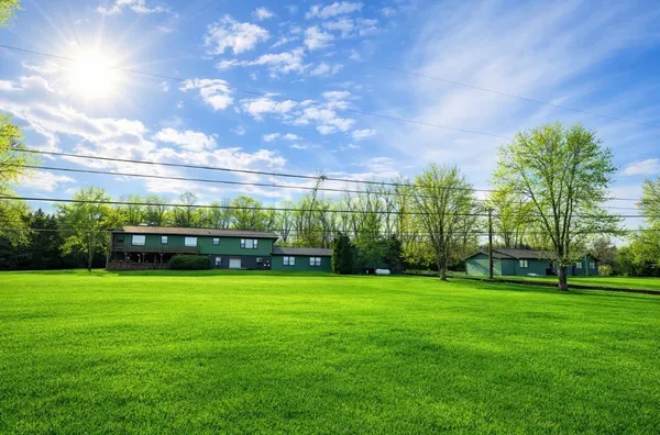 a view of a building and a big yard