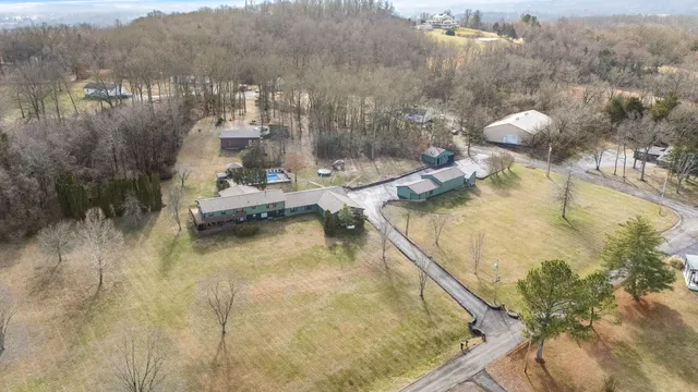 a view of a swimming pool with a patio