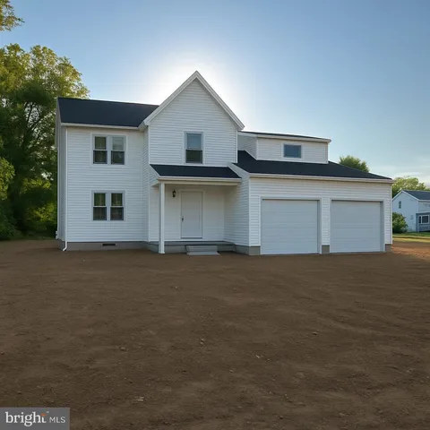 a front view of a house with a garage
