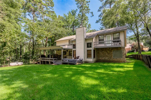 a view of a house with a yard porch and sitting area