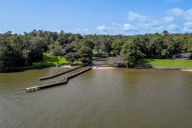 an aerial view of a city street and trees