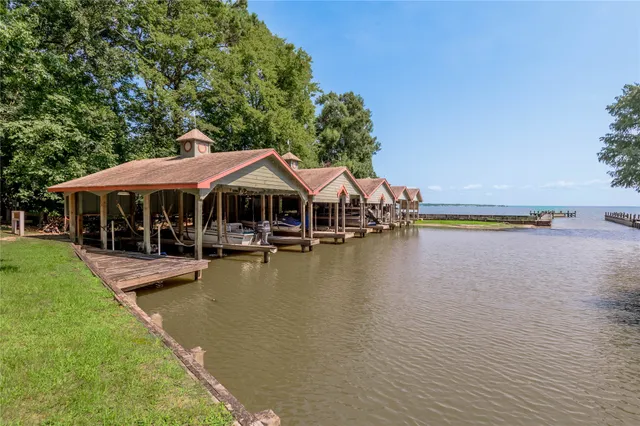 a front view of a house with swimming pool and view of house