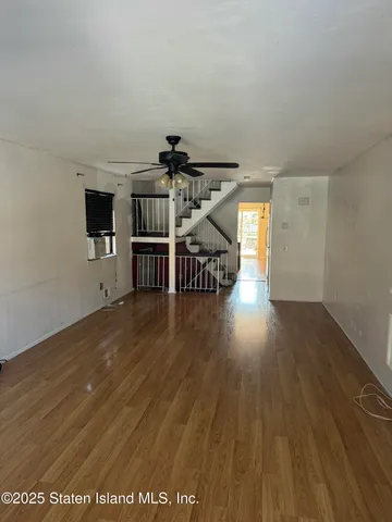 a view of a livingroom with wooden floor