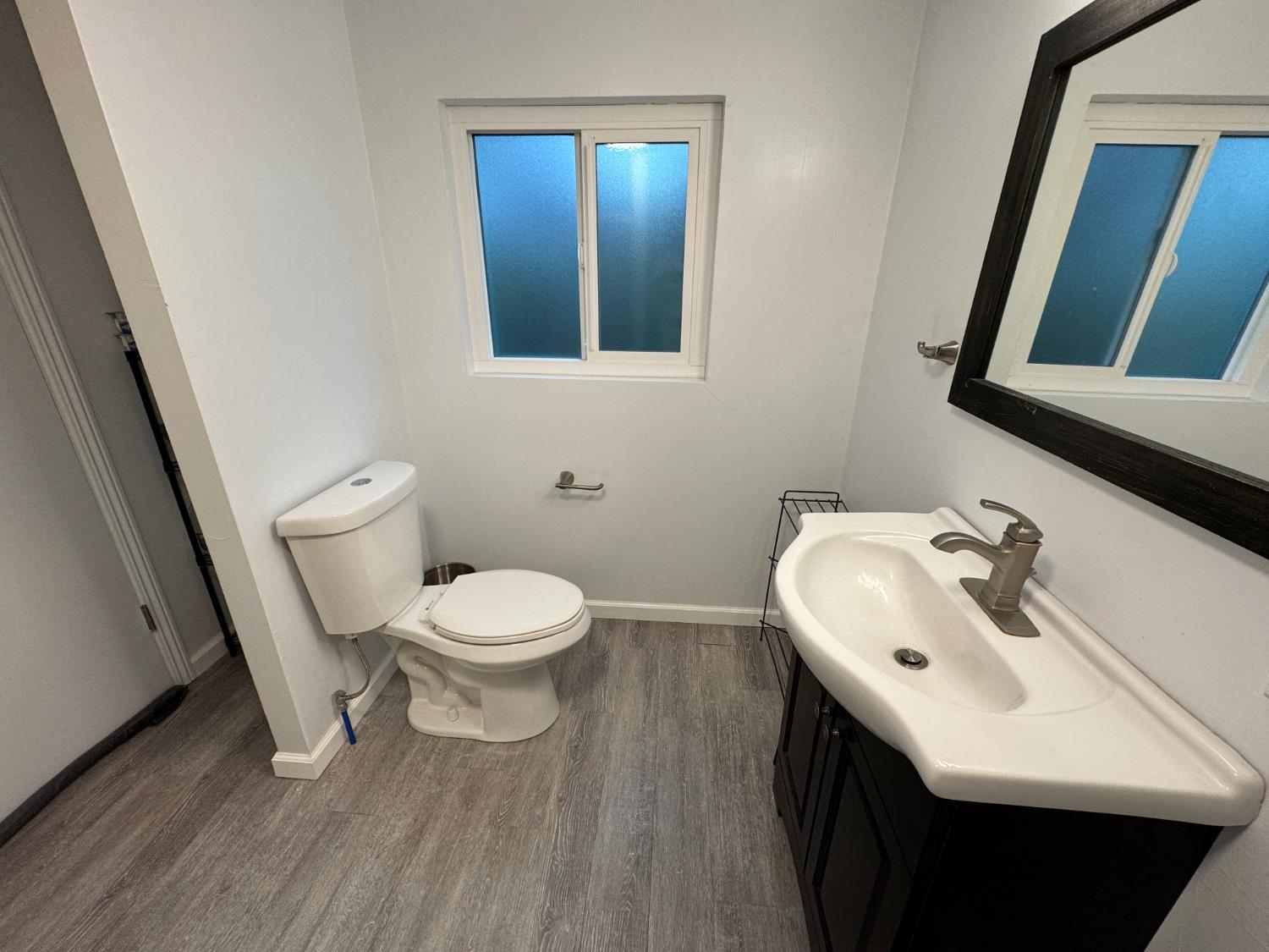 1777 Circle Drive Isleton, CA 95641 - Photo 8 of 20 a bathroom with a sink a toilet and mirror