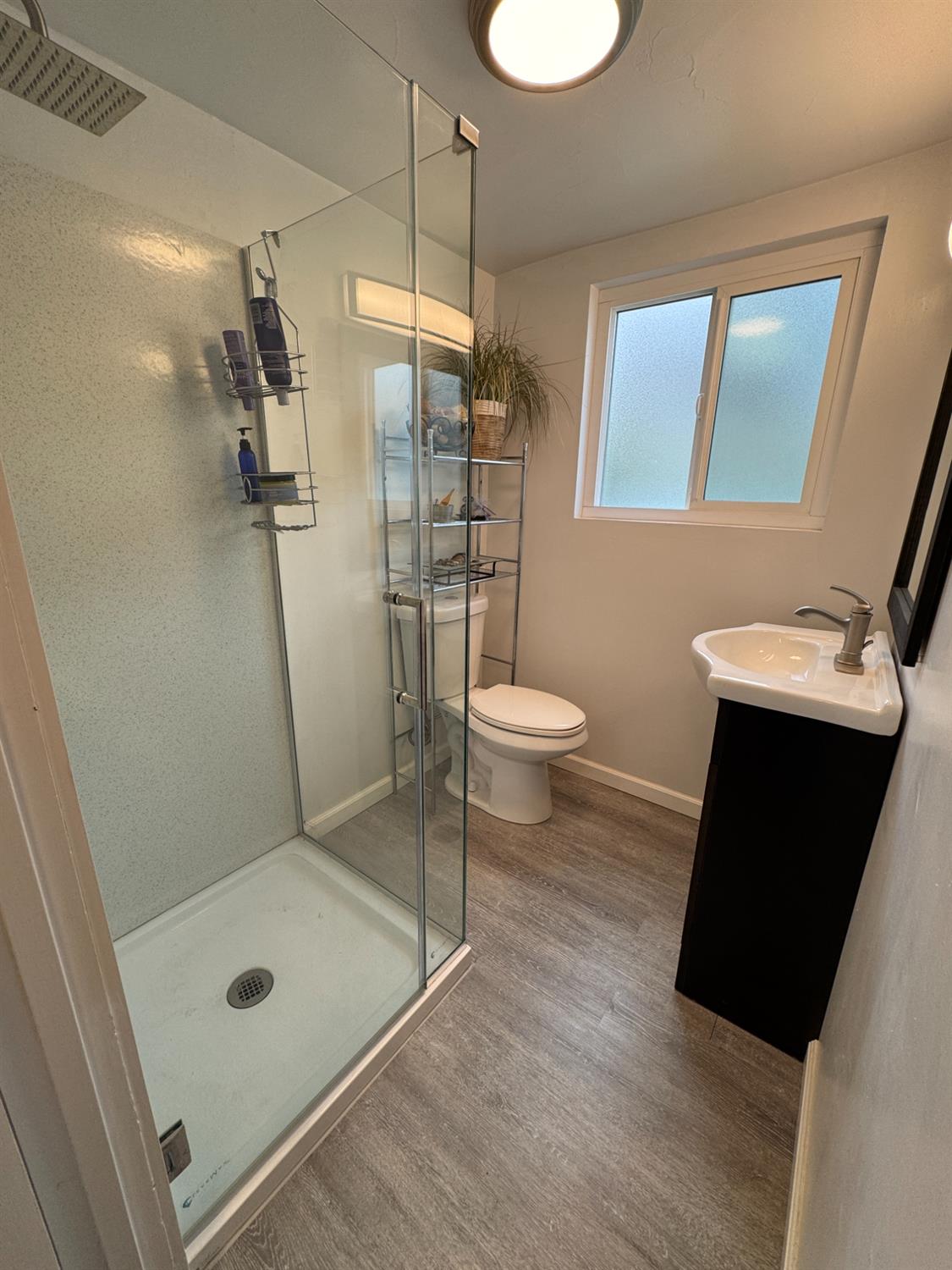 1777 Circle Drive Isleton, CA 95641 - Photo 10 of 20 a bathroom with a granite countertop sink toilet and shower