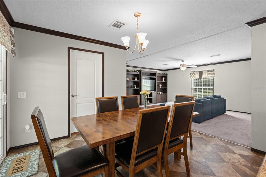 3283 Neff Lake Road Brooksville, FL 34602 - Photo 14 of 37 a view of a dining room with furniture