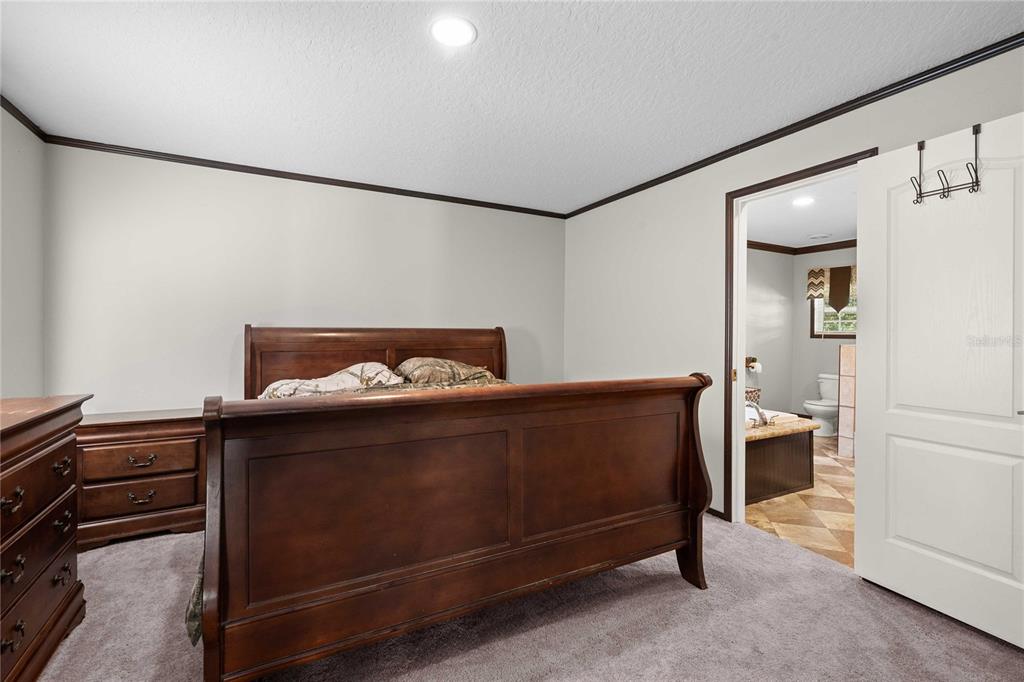 3283 Neff Lake Road Brooksville, FL 34602 - Photo 18 of 37 a living room with a bed and furniture