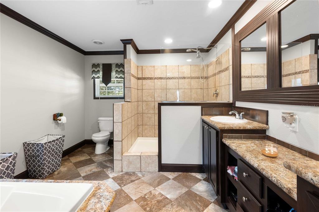 3283 Neff Lake Road Brooksville, FL 34602 - Photo 21 of 37 a bathroom with a sink toilet and shower
