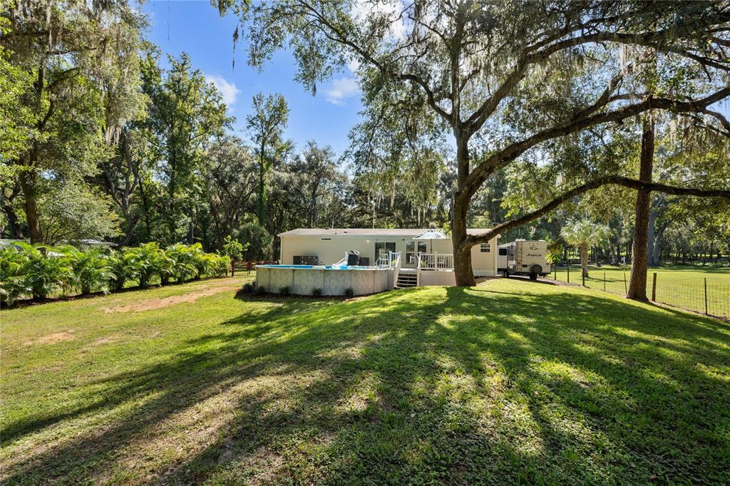 3283 Neff Lake Road Brooksville, FL 34602 - Photo 31 of 37 a view of a house with backyard and sitting area