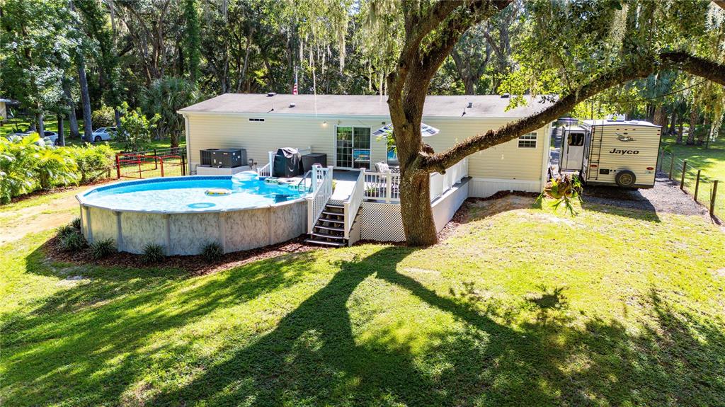 3283 Neff Lake Road Brooksville, FL 34602 - Photo 33 of 37 a view of a backyard with swimming pool