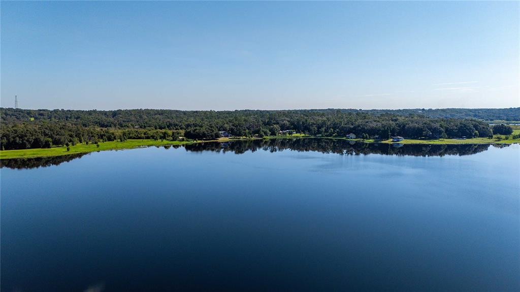 3283 Neff Lake Road Brooksville, FL 34602 - Photo 37 of 37 a view of a lake with houses in background