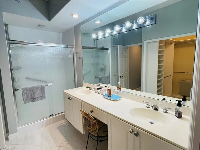 a hall with a sink and a mirror