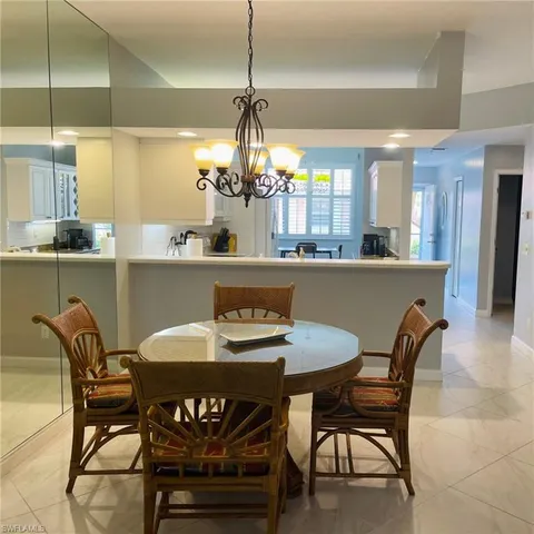 a kitchen with a sink appliances and cabinets