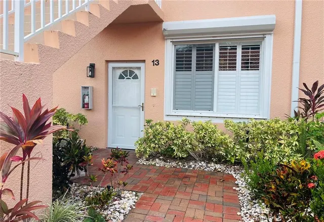 a wooden bench sitting in front of door