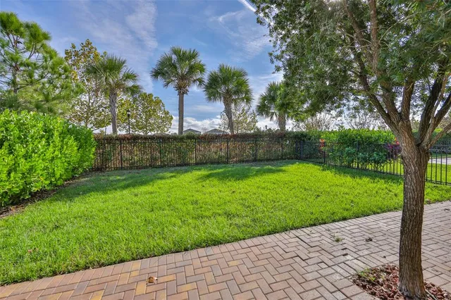 a view of swimming pool with outdoor seating and plants