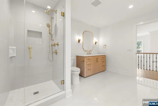 a bathroom with a mirror a sink and a mirror