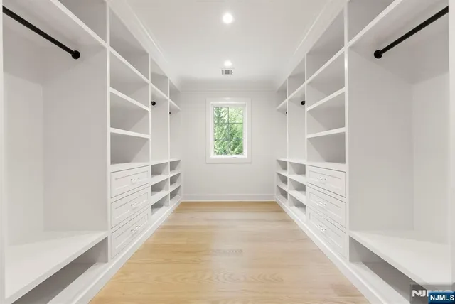 a view of an empty walk in closet