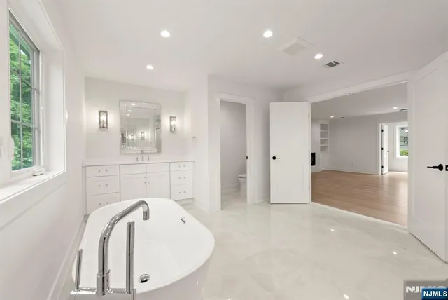 a white bath tub sitting in a bathroom