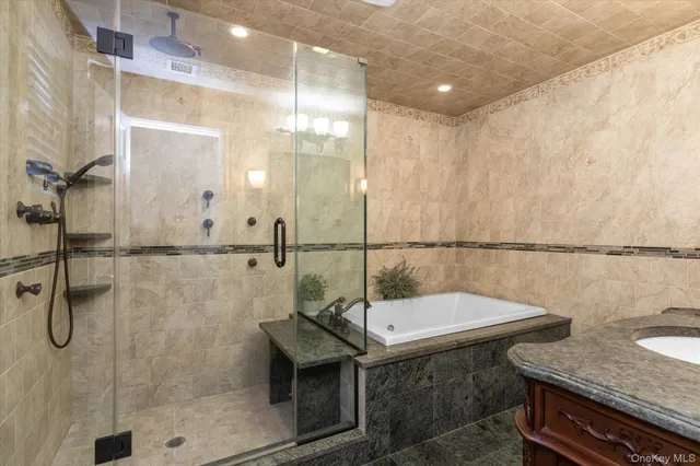 a bathroom with a sink a mirror and a shower