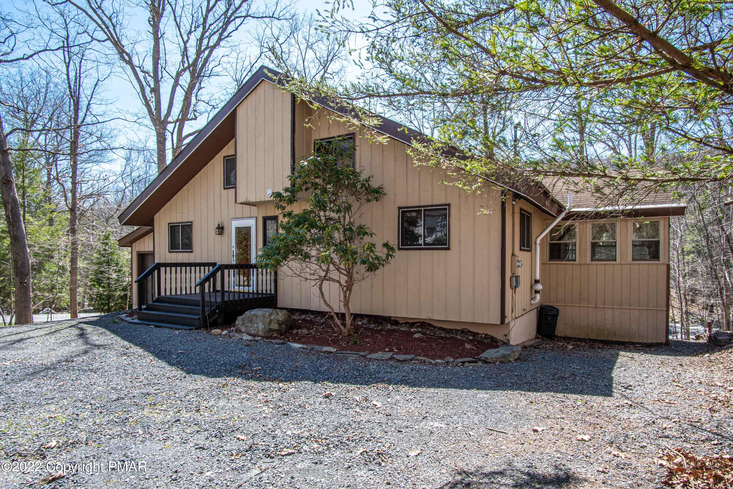 6374 Decker Road Bushkill, PA 18324 - Photo 1 of 60 a front view of a house with a yard