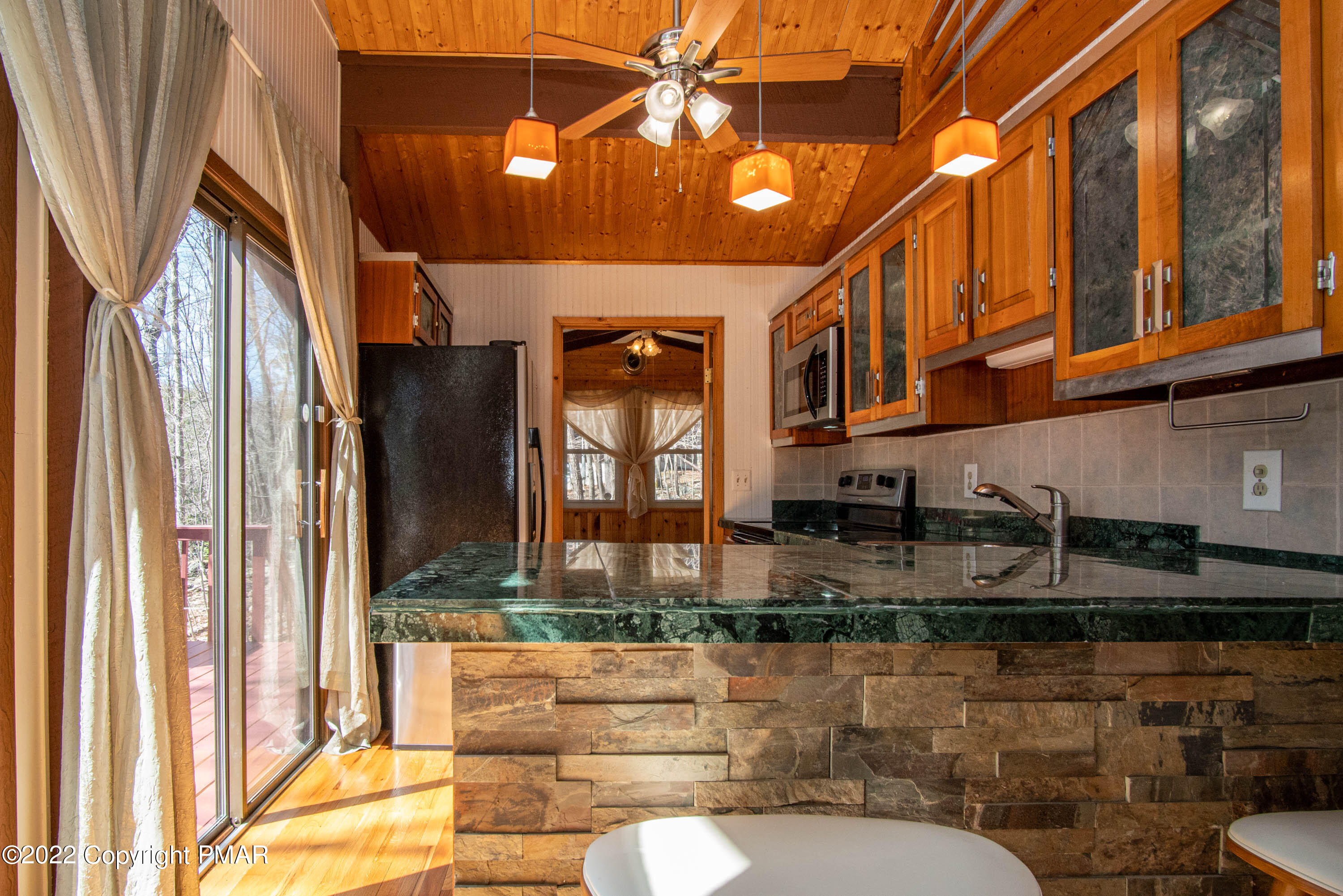 6374 Decker Road Bushkill, PA 18324 - Photo 11 of 60 a bathroom with a sink a mirror and a shower curtain