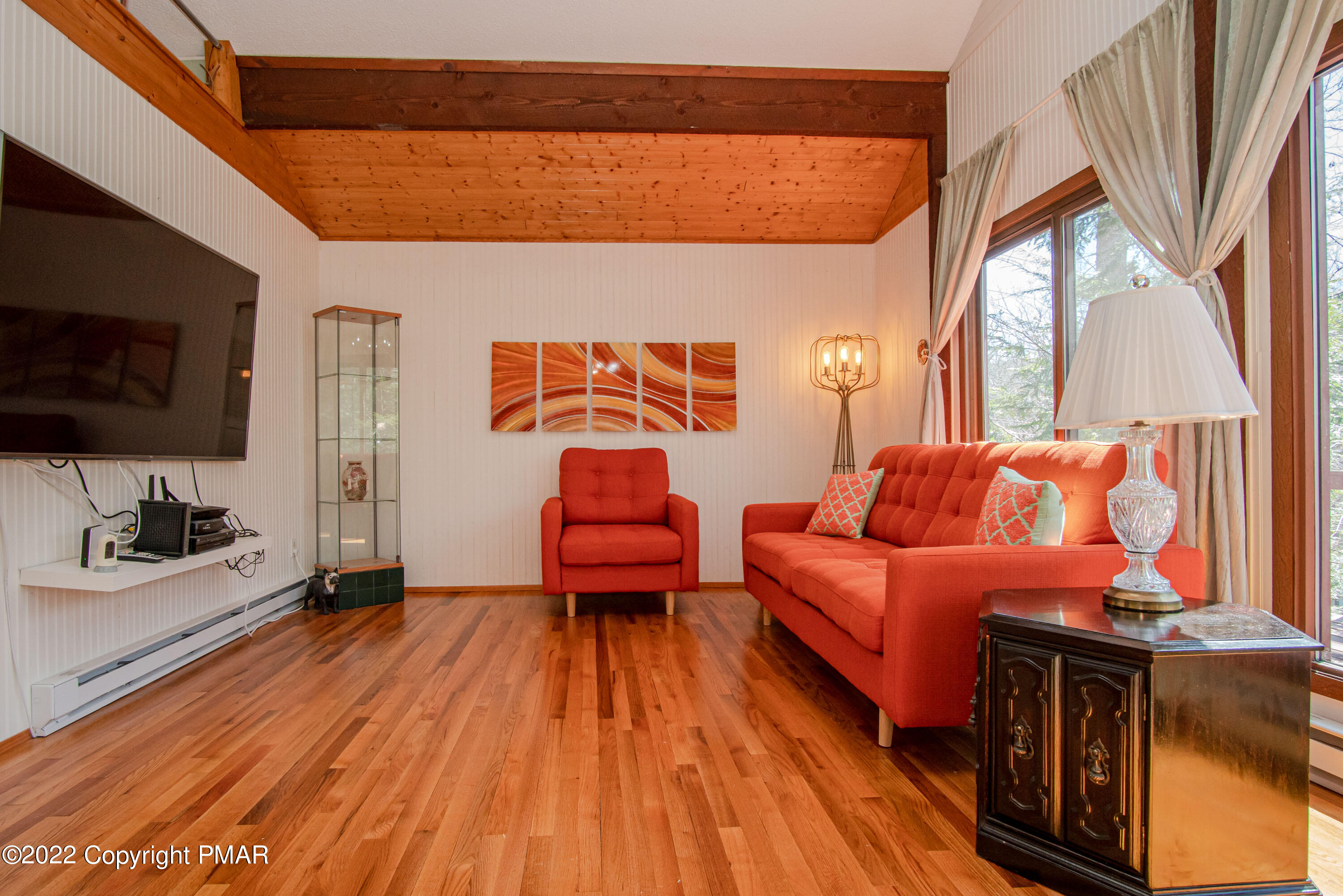 6374 Decker Road Bushkill, PA 18324 - Photo 17 of 60 a living room with blue lights with furniture and wooden floor