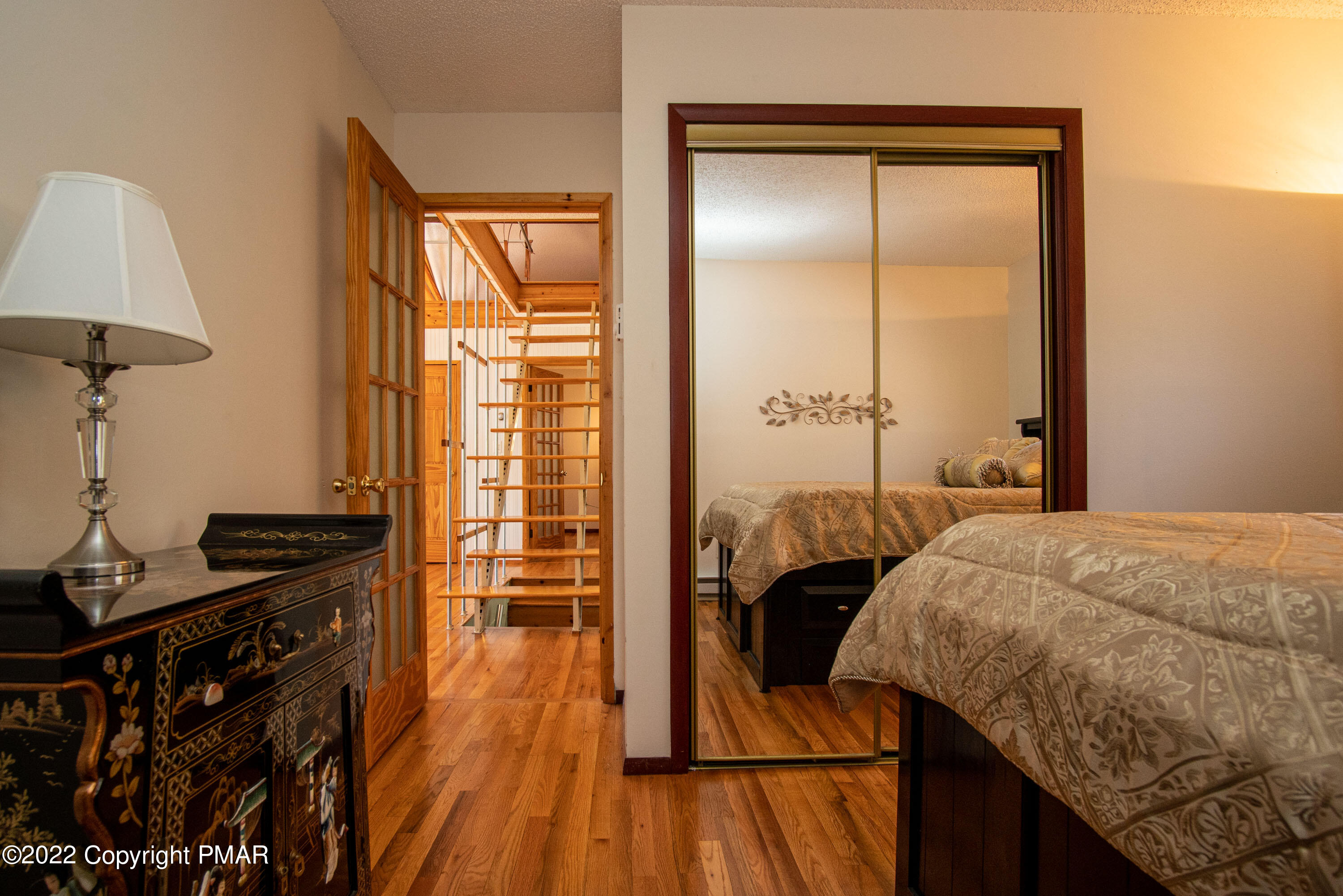 6374 Decker Road Bushkill, PA 18324 - Photo 20 of 60 a bedroom with a bed and a table in it