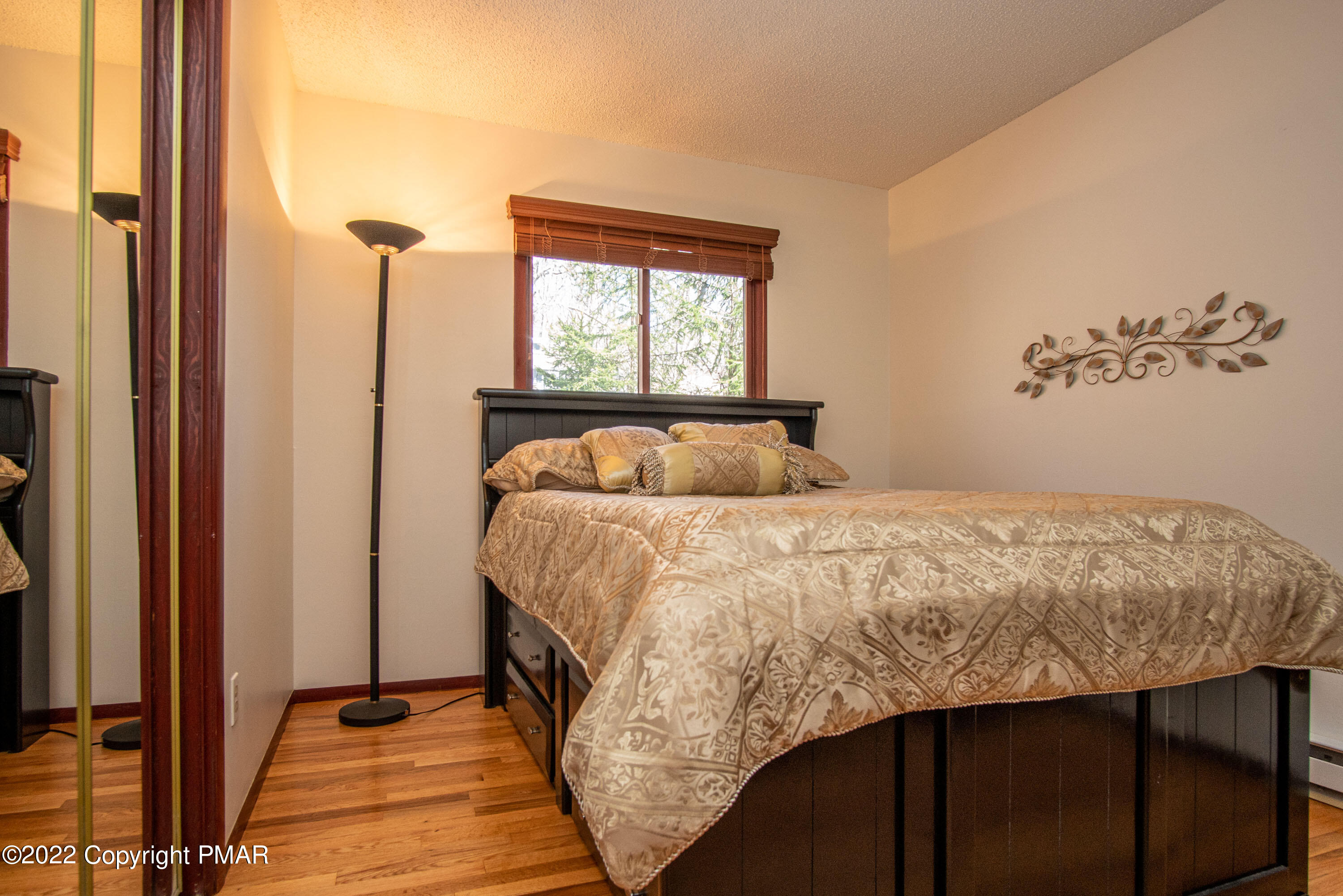 6374 Decker Road Bushkill, PA 18324 - Photo 21 of 60 a bedroom with a bed and a window