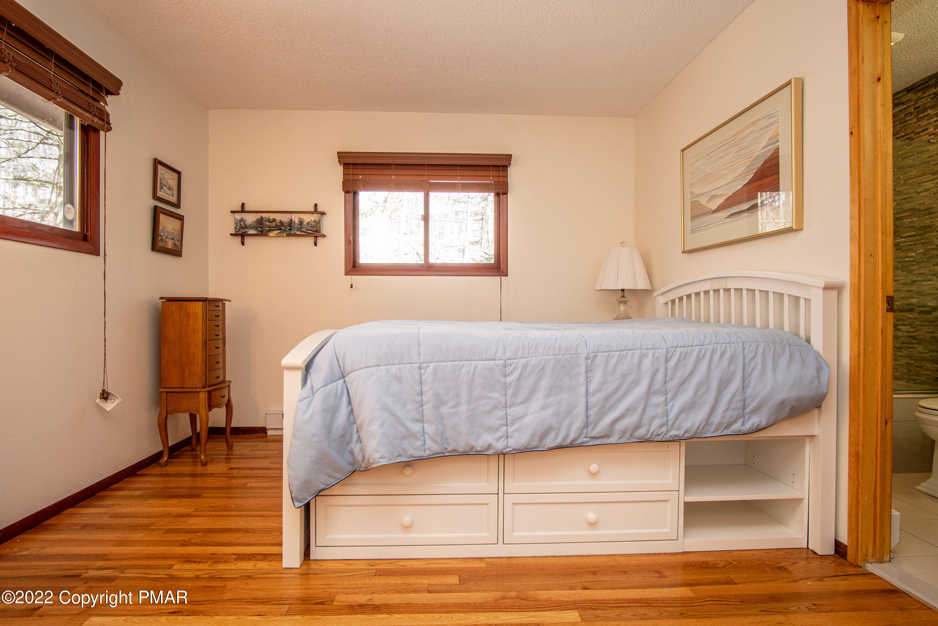 6374 Decker Road Bushkill, PA 18324 - Photo 26 of 60 a living room with a bed furniture and a window