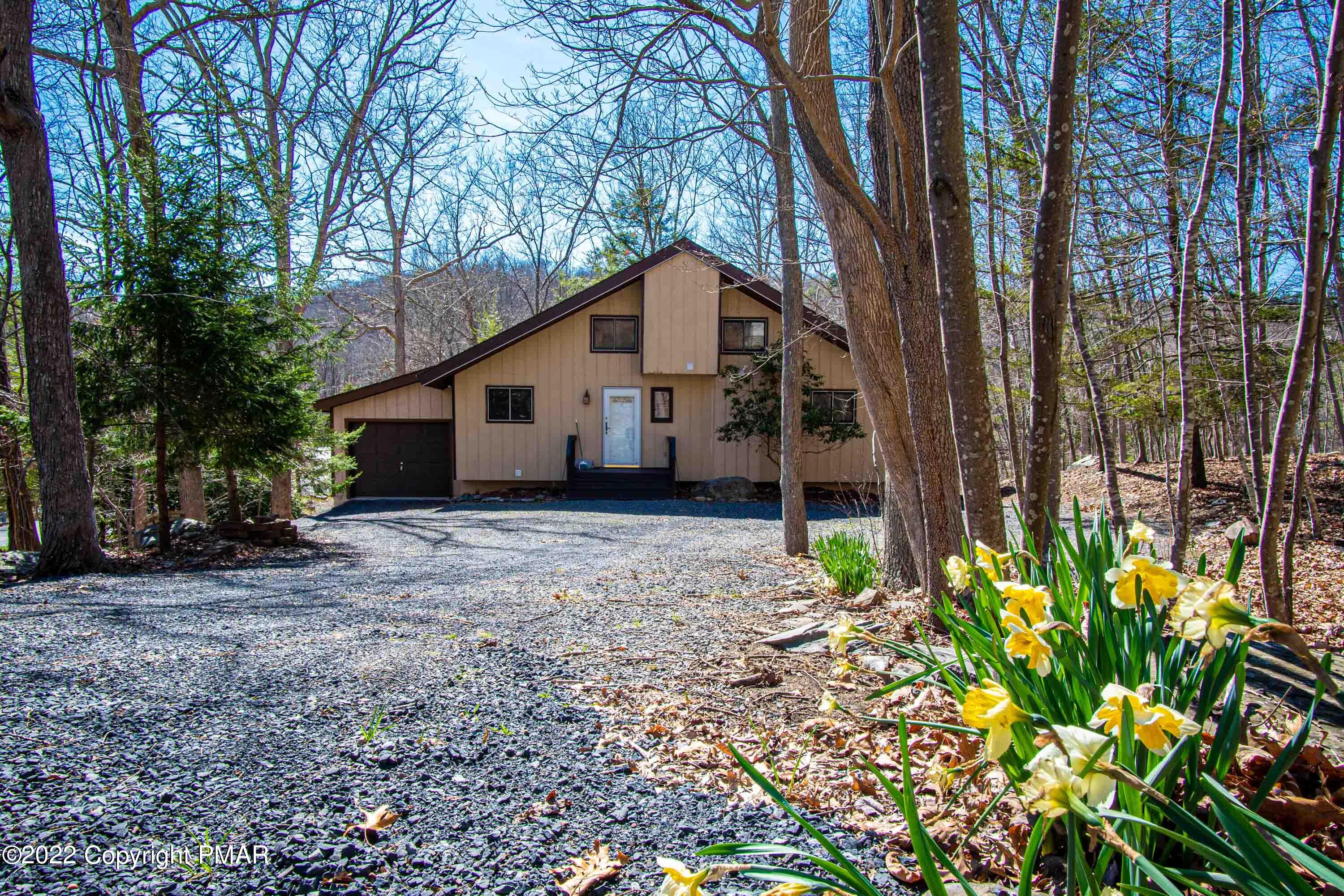 6374 Decker Road Bushkill, PA 18324 - Photo 3 of 60 a house with trees in front of it