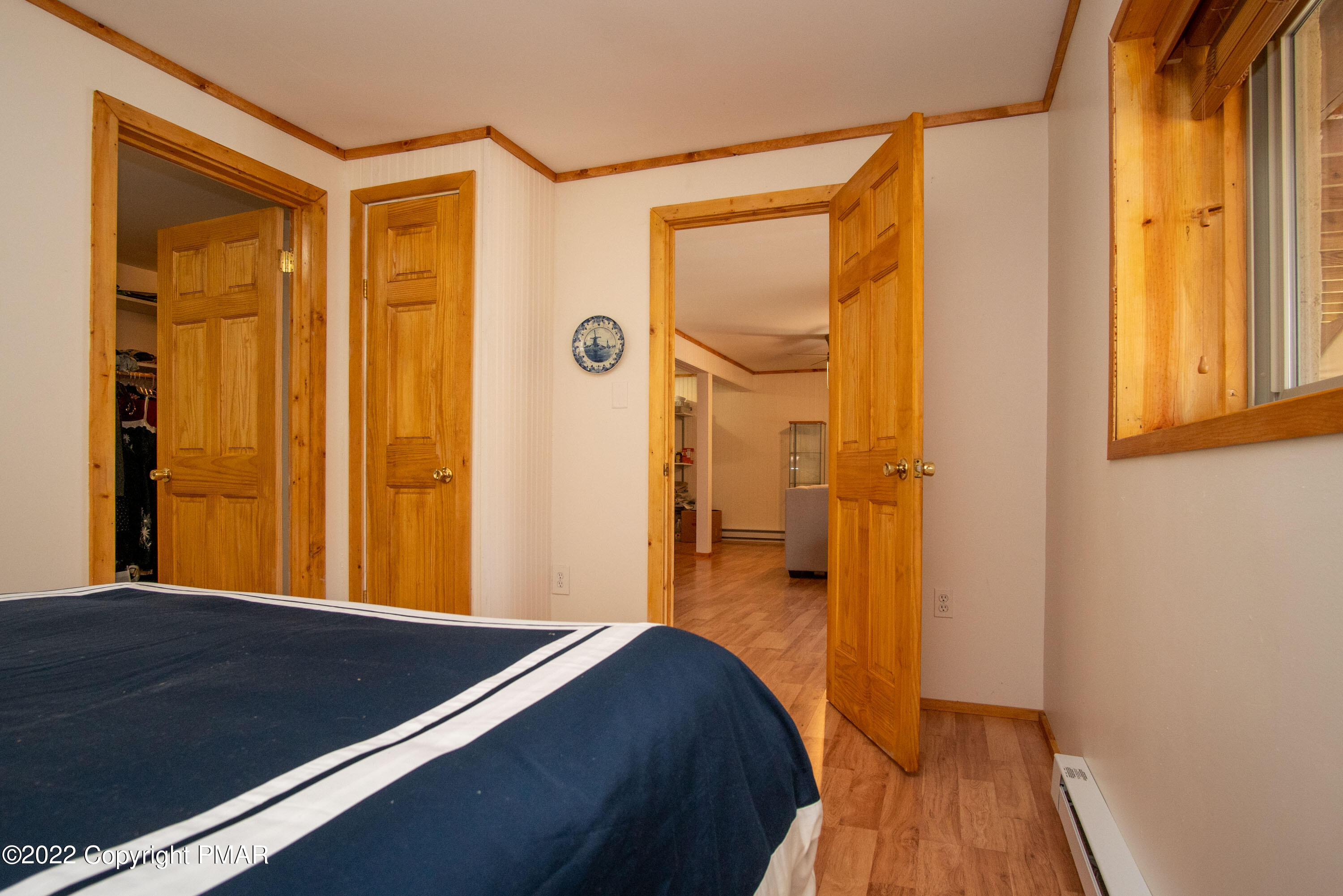 6374 Decker Road Bushkill, PA 18324 - Photo 44 of 60 a view of a hallway with a bedroom and wooden floor