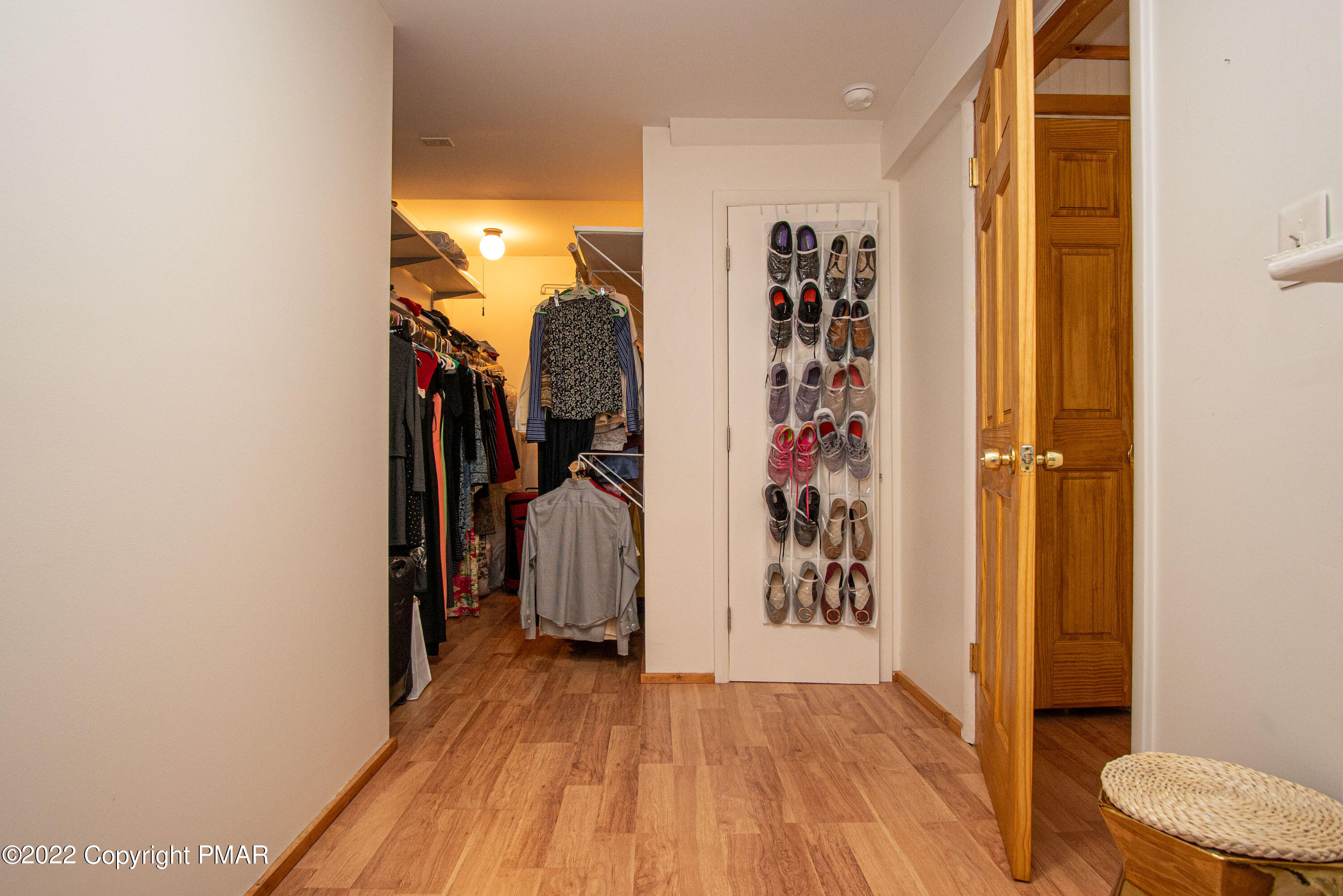 6374 Decker Road Bushkill, PA 18324 - Photo 45 of 60 a view of a walk in closet with clothes and shoes