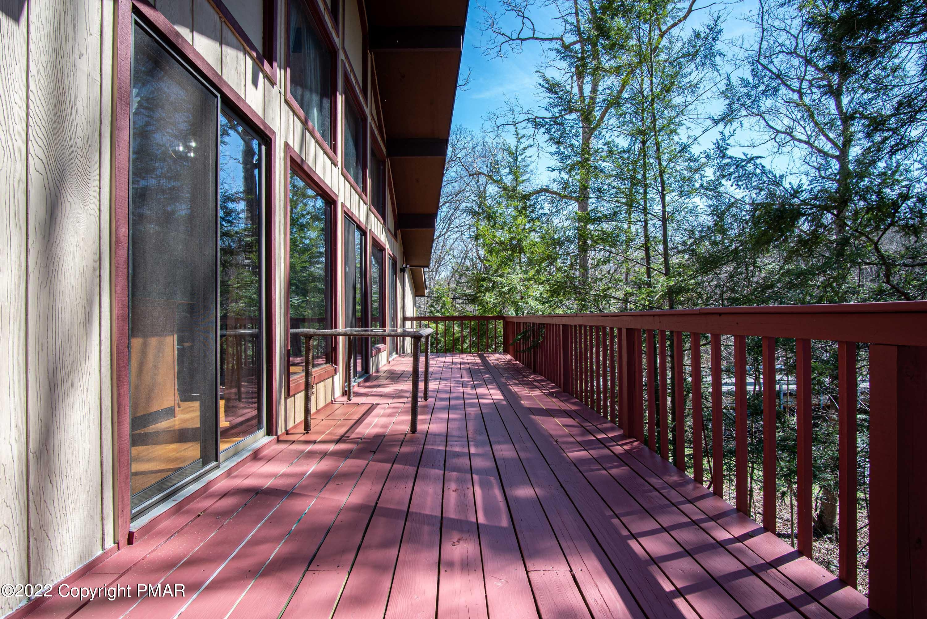 6374 Decker Road Bushkill, PA 18324 - Photo 49 of 60 a view of balcony with wooden floor and fence