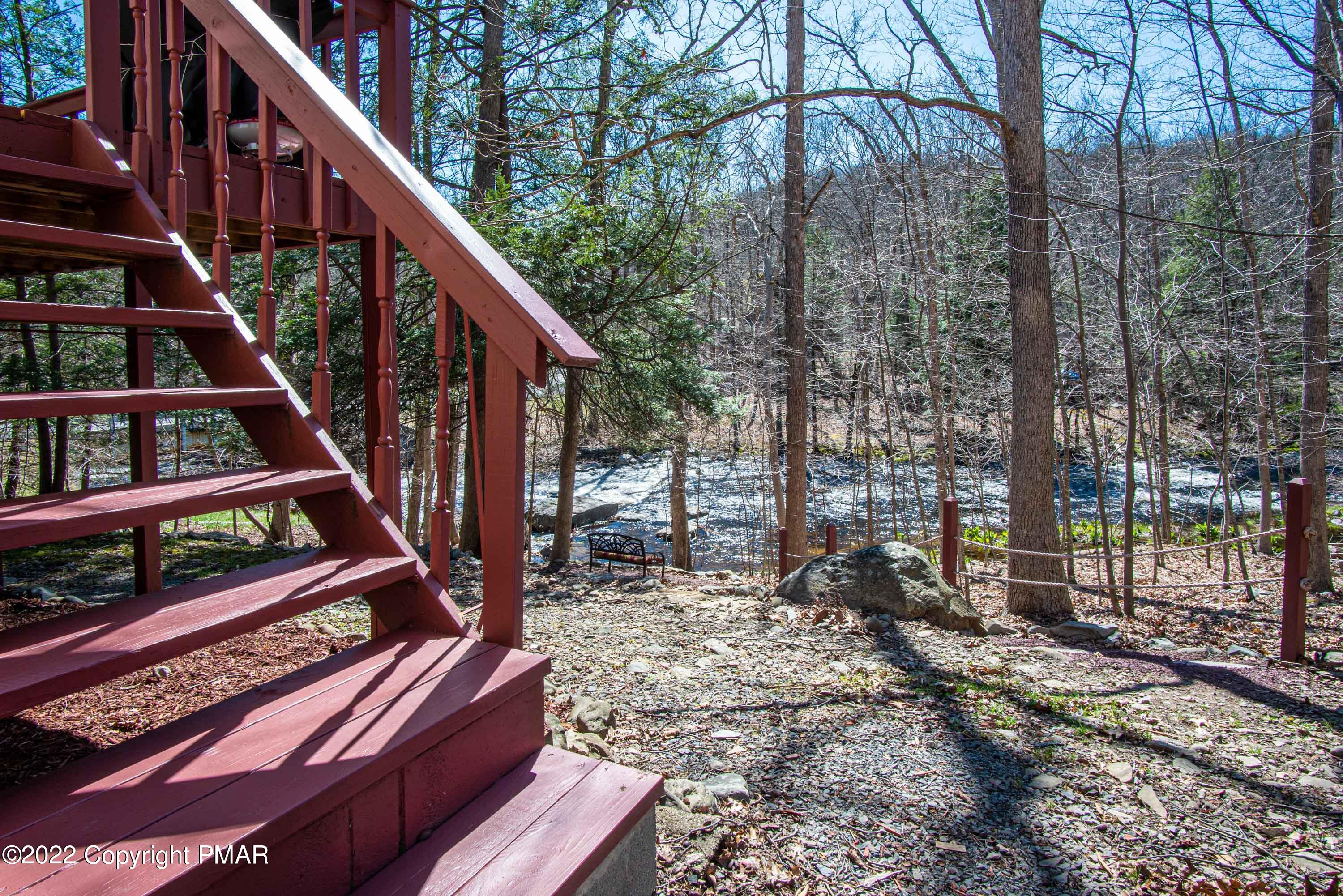 6374 Decker Road Bushkill, PA 18324 - Photo 50 of 60 a view of deck with wooden floor and trees