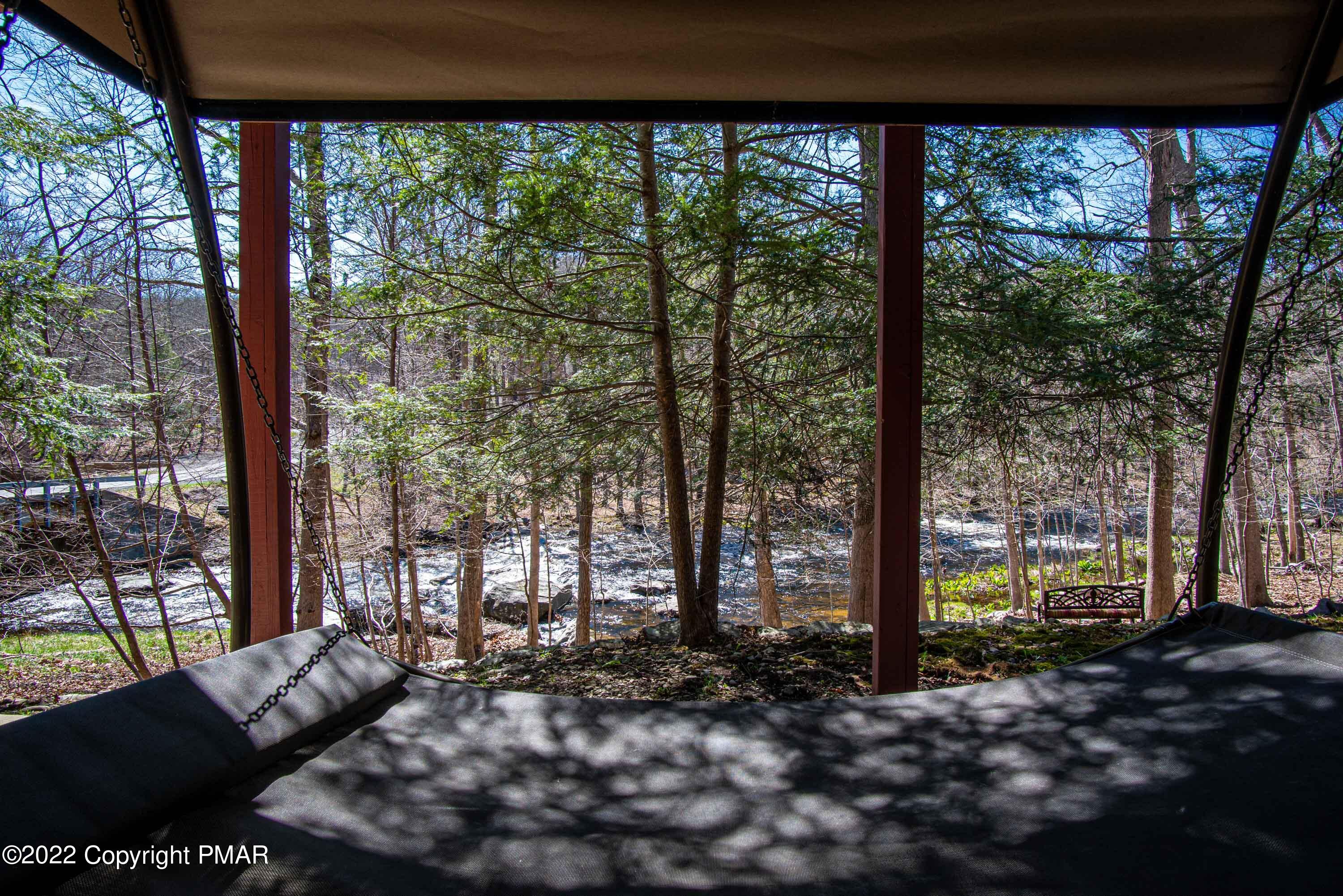 6374 Decker Road Bushkill, PA 18324 - Photo 53 of 60 a living room filled with furniture and a large tree