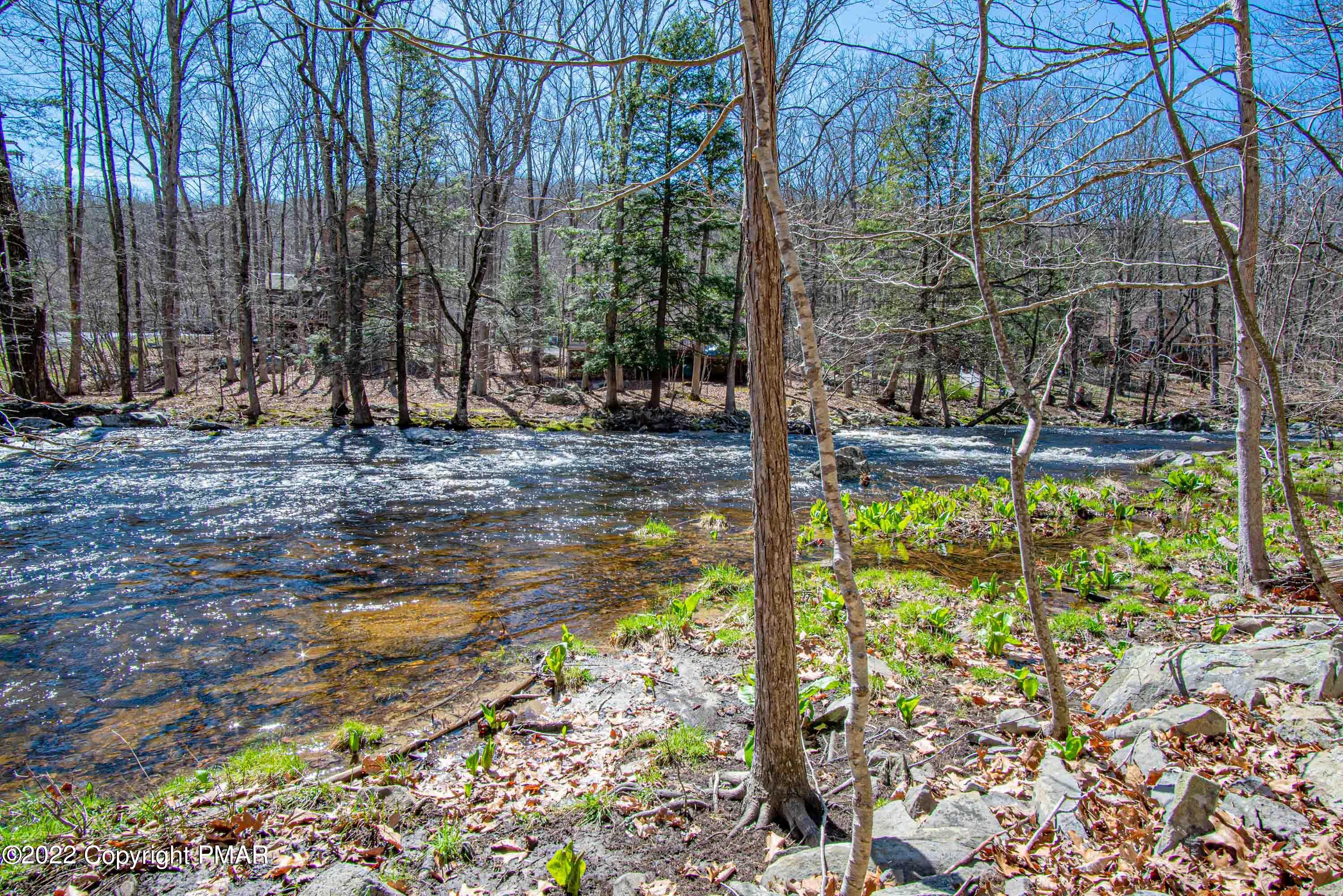 6374 Decker Road Bushkill, PA 18324 - Photo 60 of 60 a backyard of a house with lots of green space