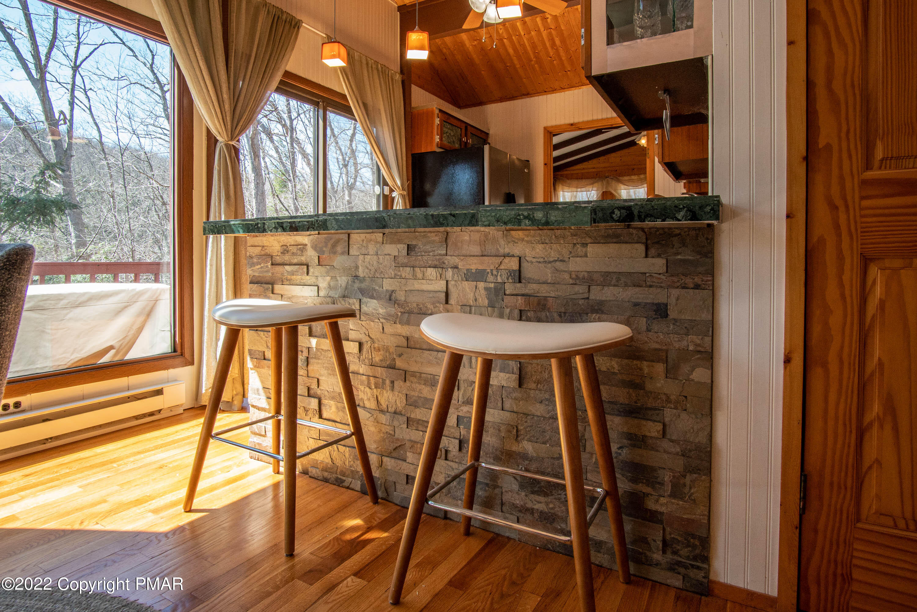 6374 Decker Road Bushkill, PA 18324 - Photo 10 of 60 a view of a chairs and table in the balcony